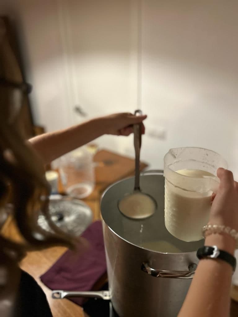 Ladling curds into the mould